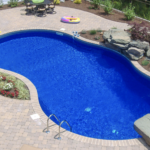 Vinyl inground pool with concrete decking